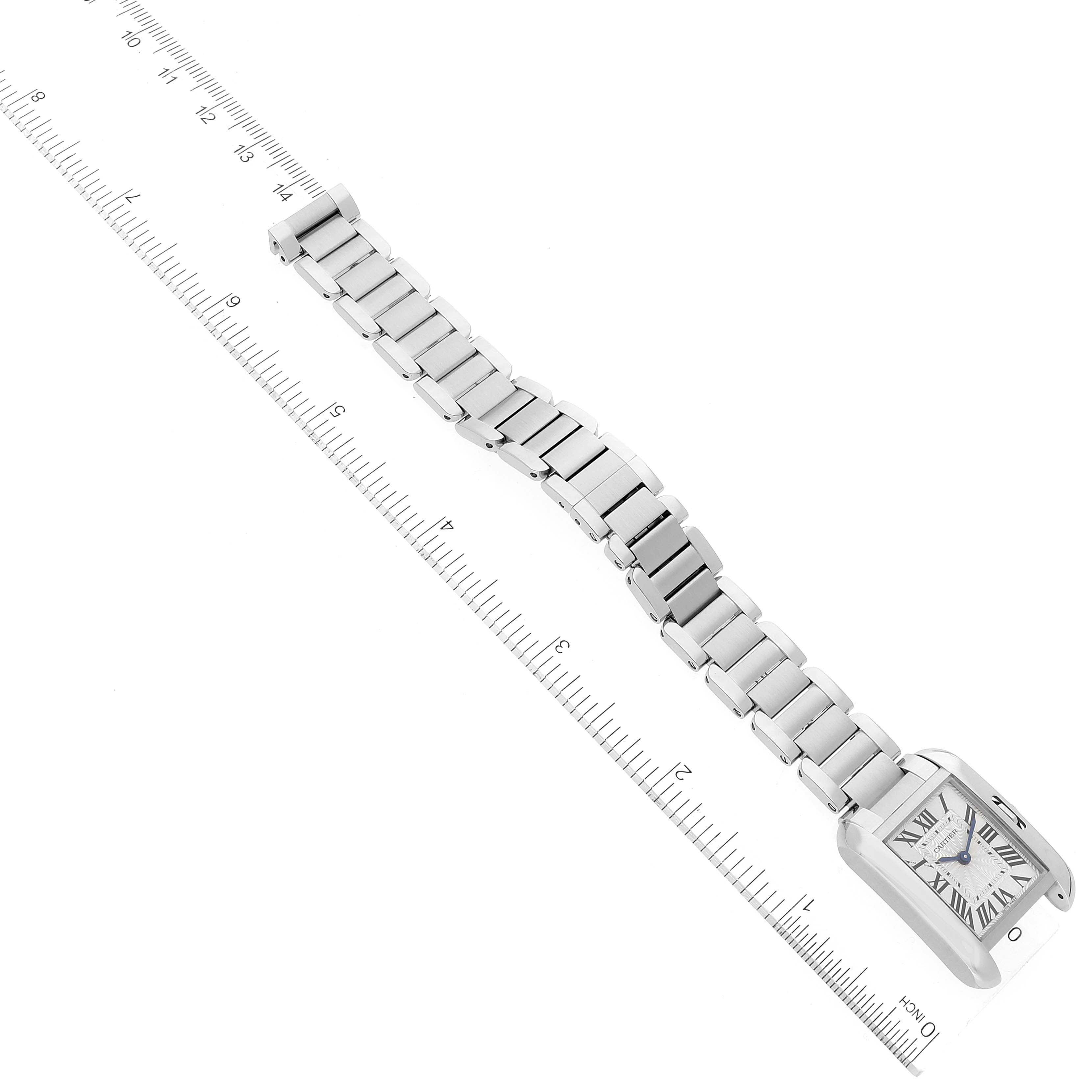 The Cartier Tank Anglaise W5310022 Women's Stainless Steel Silver Dial W5310022 Women's Stainless Steel Silver Dial watch is shown from an overhead angle, displaying the entire face and bracelet alongside a ruler for scale.