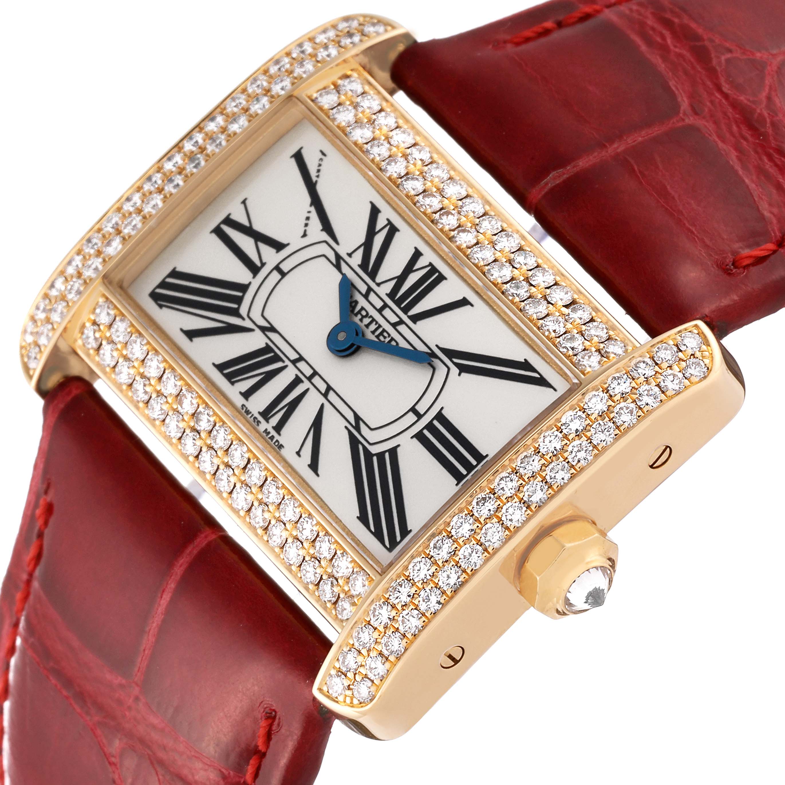 The Cartier Tank Divan WA301071 Women's Yellow Gold Silver Dial WA301071 Women's Yellow Gold Silver Dial watch is shown from a tilted top-down angle, highlighting the face, crown, and red leather strap.