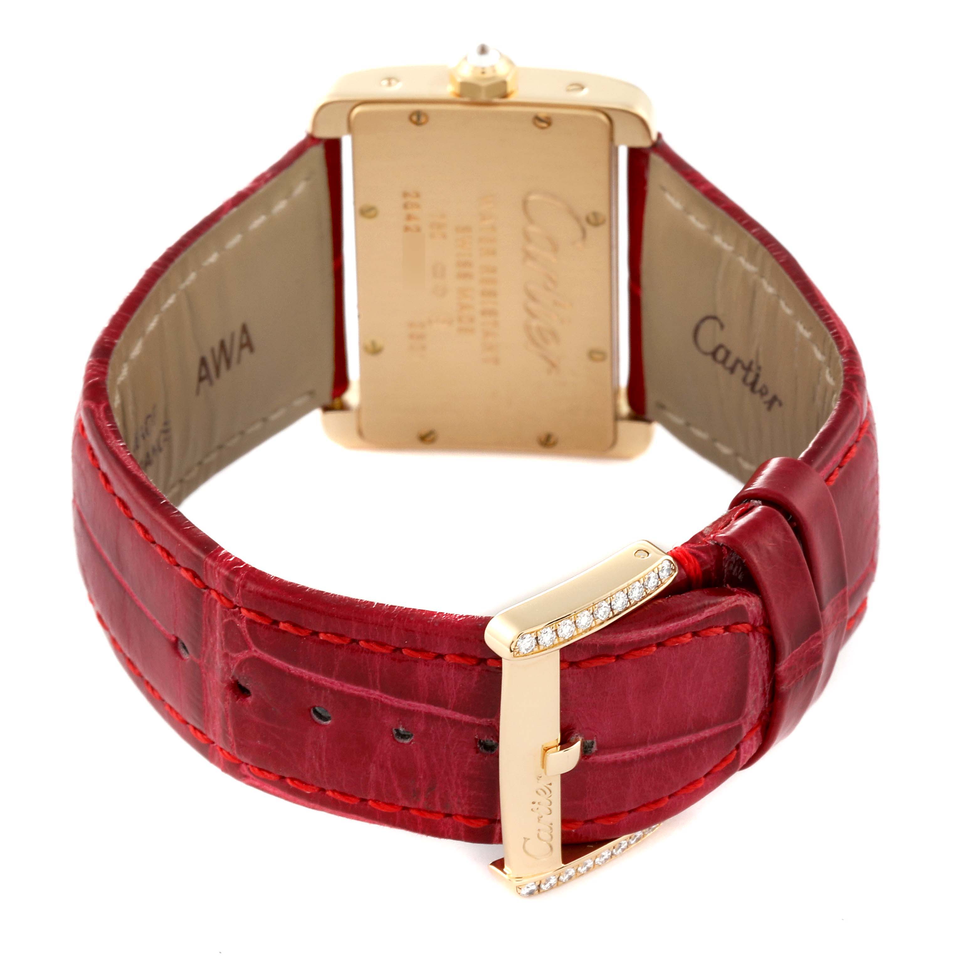 The image shows the back and strap of a Cartier Tank Divan WA301071 Women's Yellow Gold Silver Dial WA301071 Women's Yellow Gold Silver Dial watch, featuring a red leather band and gold buckle with diamond accents.