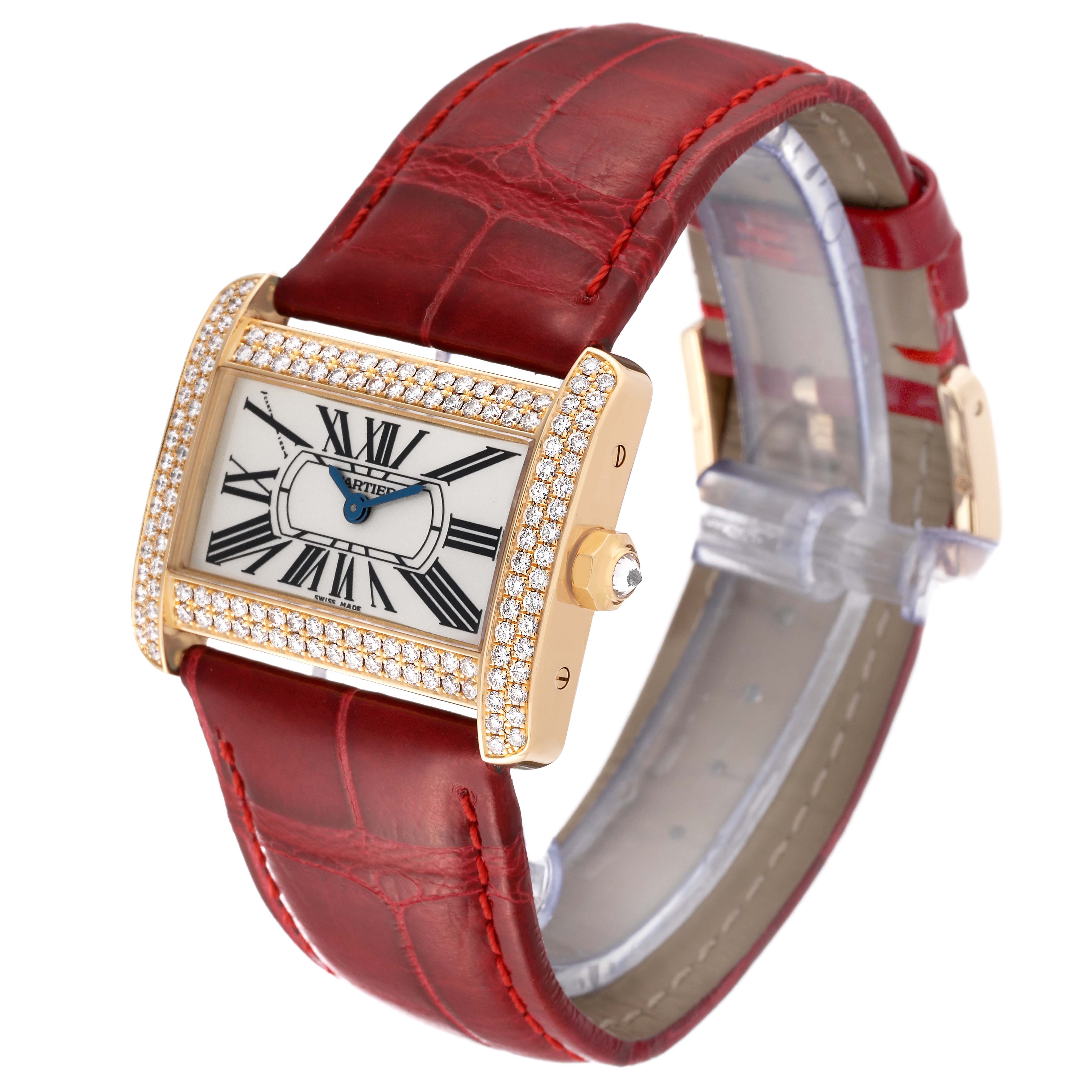 The image shows a Tank Divan model by Cartier at a front angle, highlighting its red strap, rectangular face, and diamond-encrusted bezel.