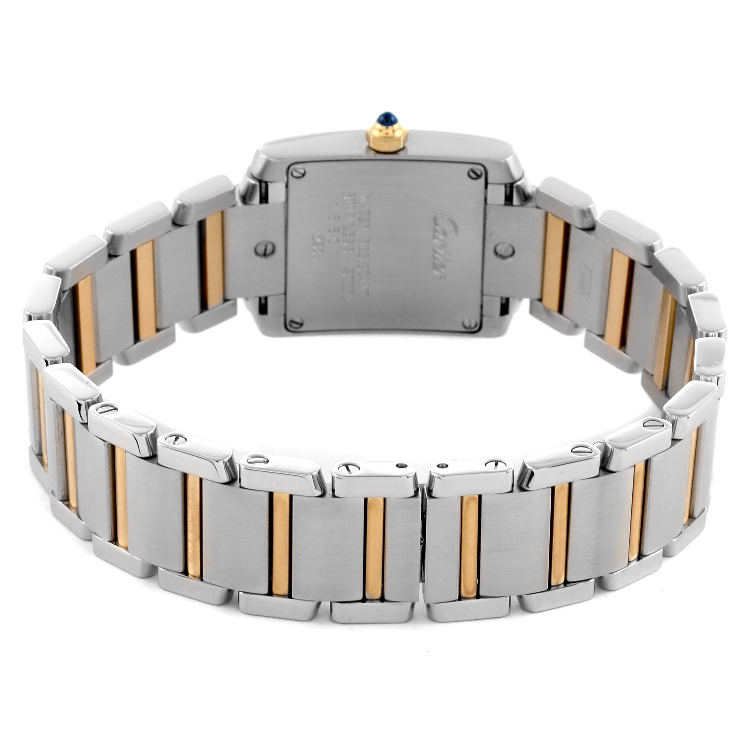 The image shows the back view of a Cartier Tank Française watch, highlighting the two-tone metal bracelet and case back.
