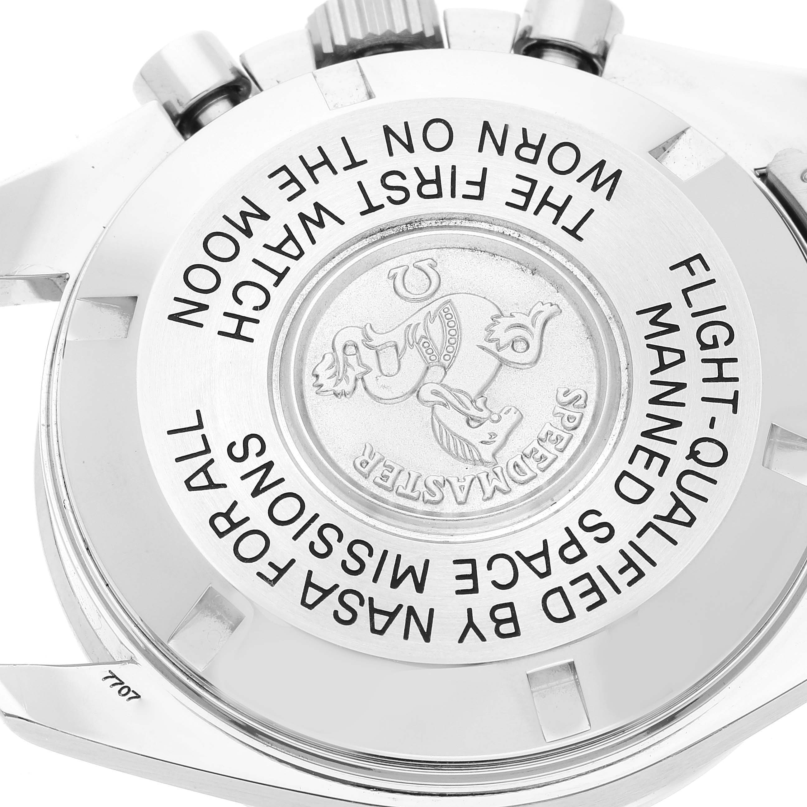 The image shows the back casing of an Omega Speedmaster 3570.50.00 Men's Stainless Steel Black Dial 3570.50.00 Men's Stainless Steel Black Dial watch, highlighting its inscriptions and emblem.