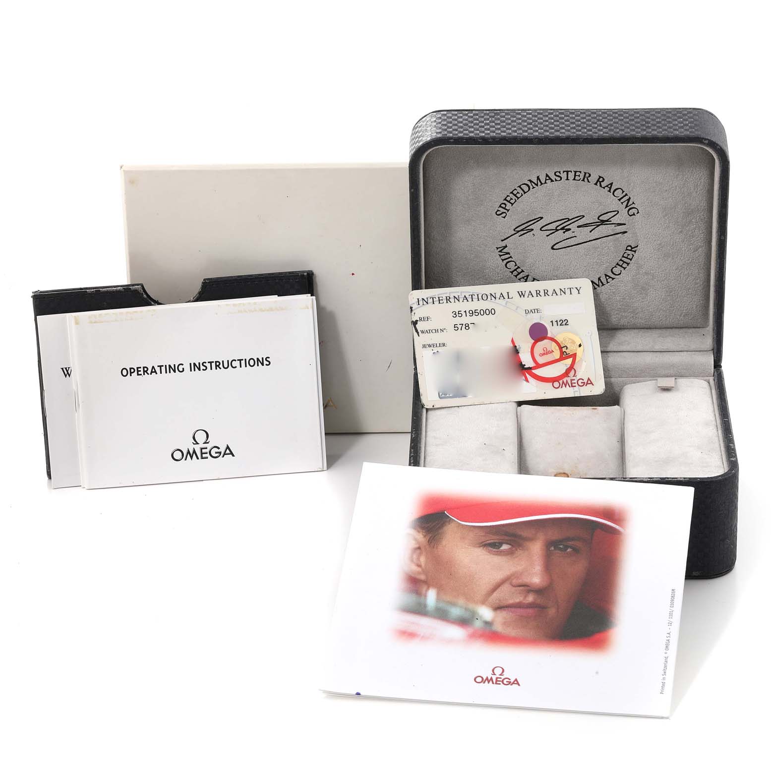 The image shows an Omega Speedmaster 3519.50.00 Men's Stainless Steel Black Dial 3519.50.00 Men's Stainless Steel Black Dial watch box, warranty card, operating instructions, and promotional booklet.