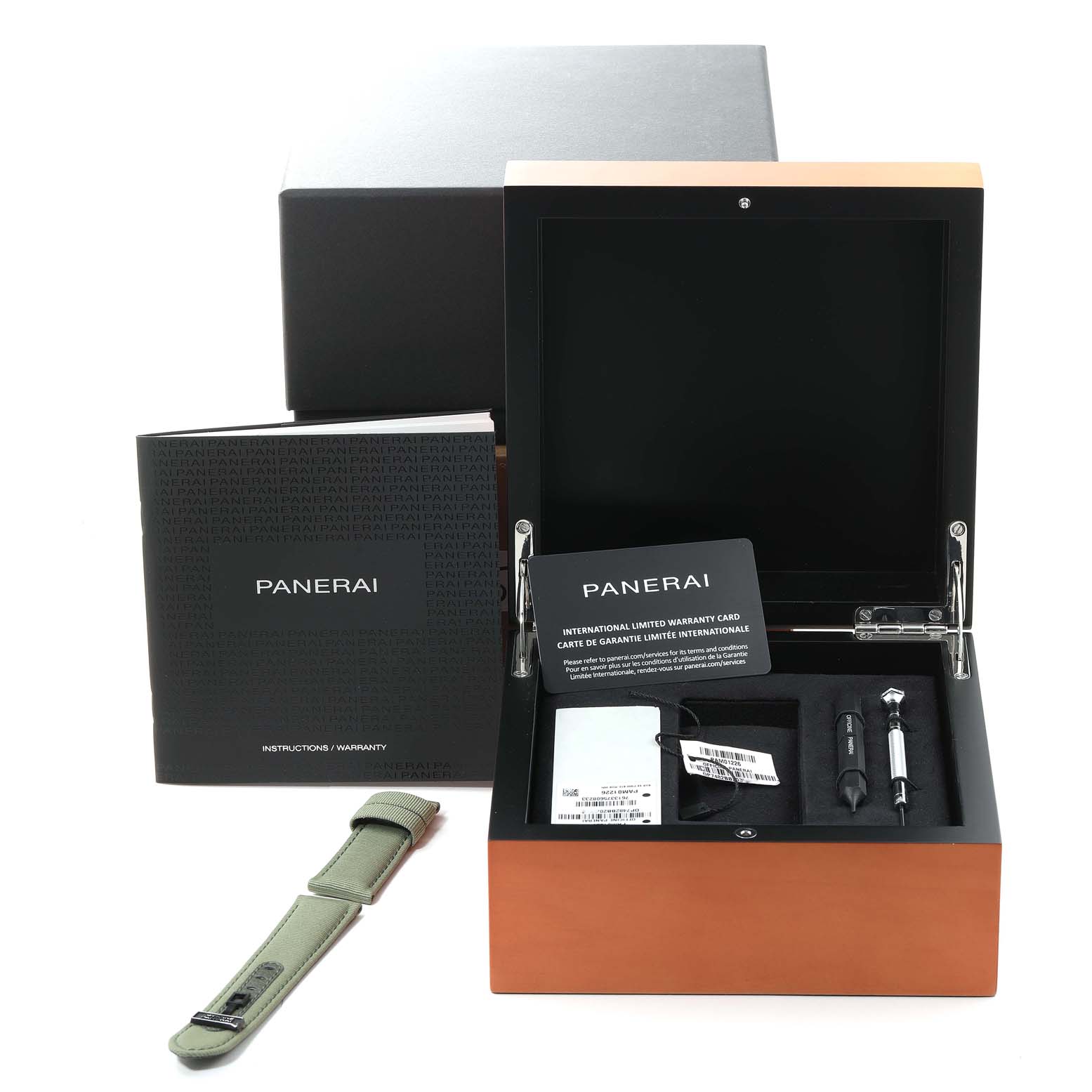 The image shows a Panerai Submersible PAM01226 Men
s Stainless Steel White Dial PAM01226 Men
s Stainless Steel White Dial watch box with accessories, instruction manual, warranty cards, and an extra strap.