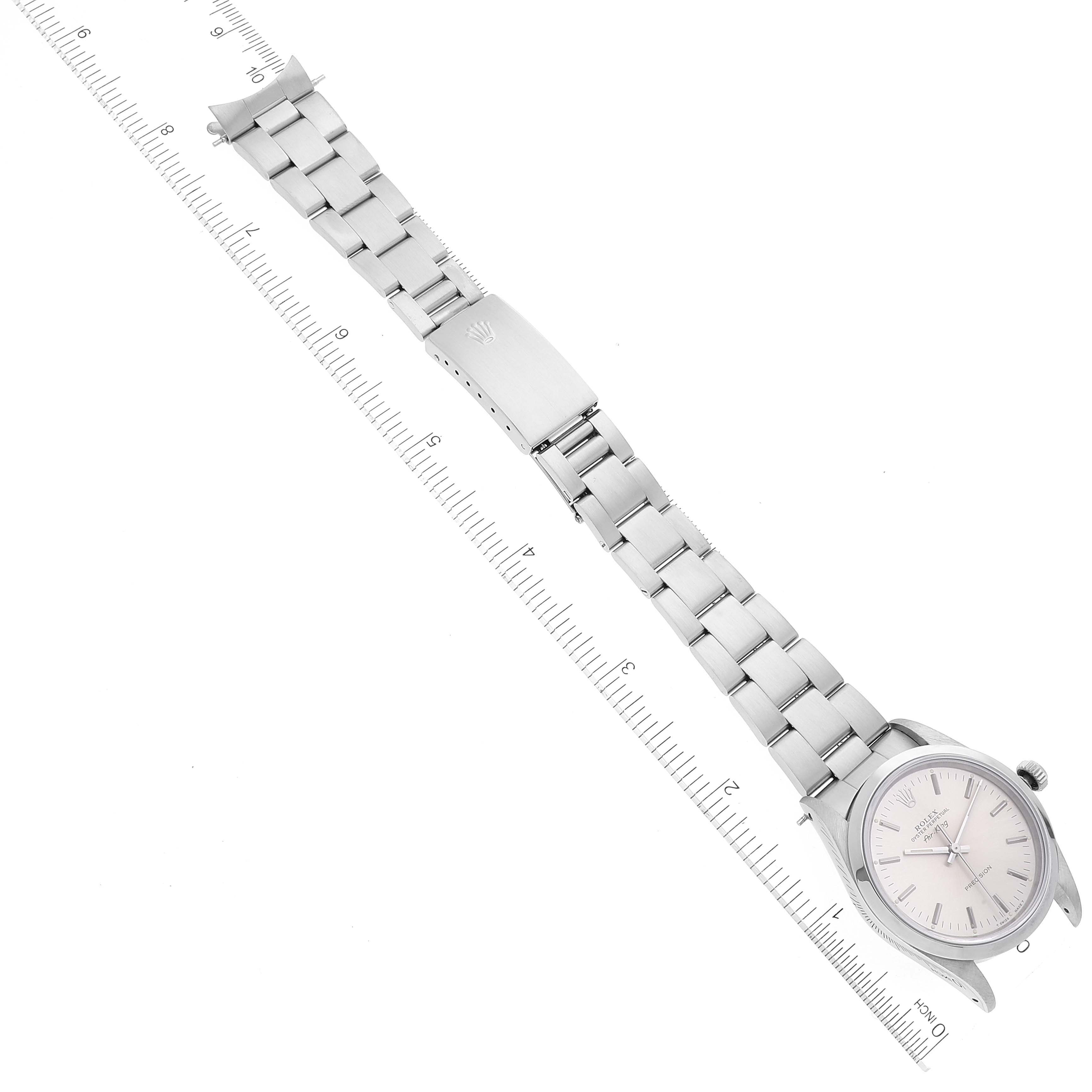 The Rolex Air-King 14000 Men's Stainless Steel Silver Dial 14000 Men's Stainless Steel Silver Dial watch is shown from a top-down angle, displaying the full face and metal bracelet with ruler measurements.