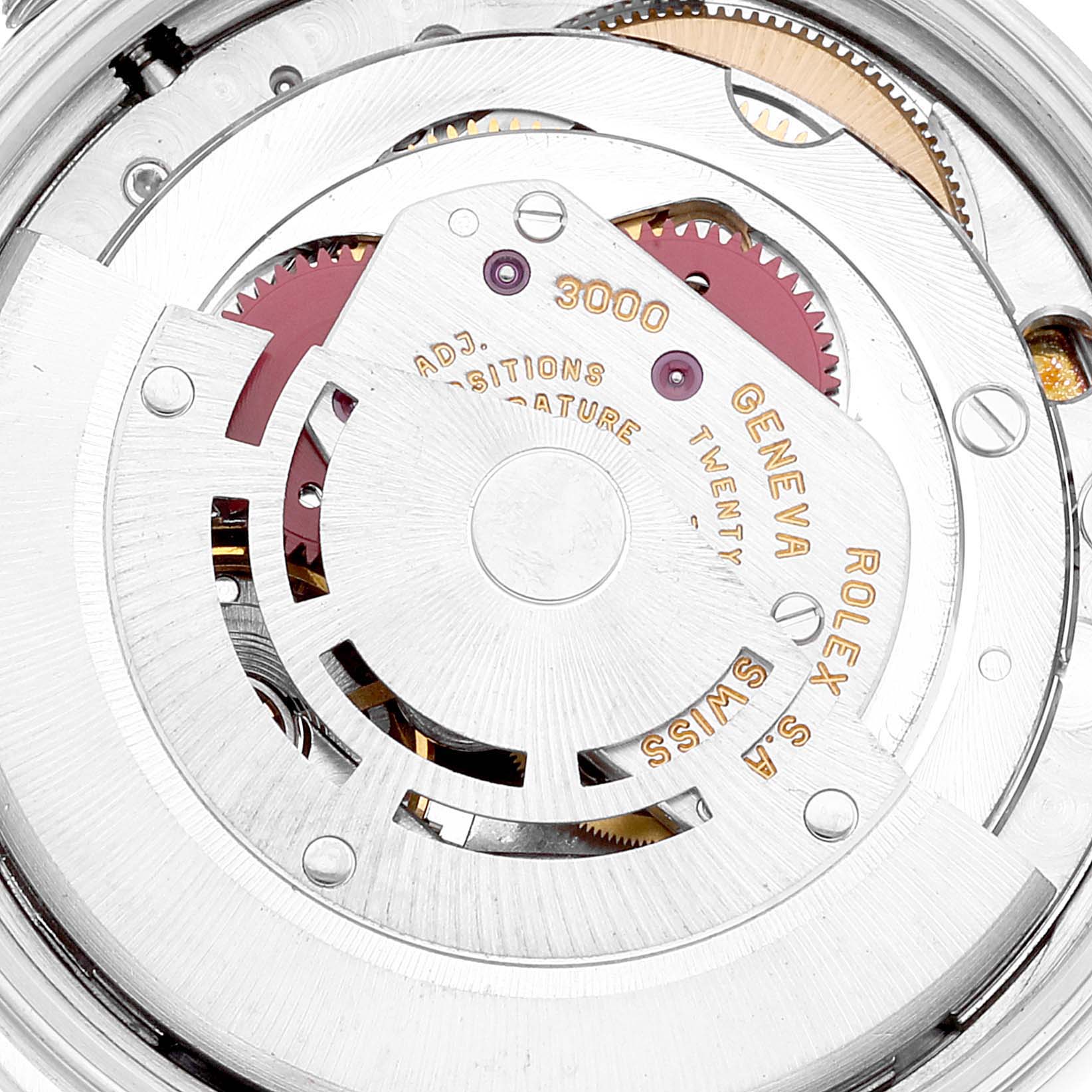 The image shows a close-up of the movement mechanism of a Rolex Air-King 14000 Men's Stainless Steel Silver Dial 14000 Men's Stainless Steel Silver Dial watch, highlighting gears and inscriptions.