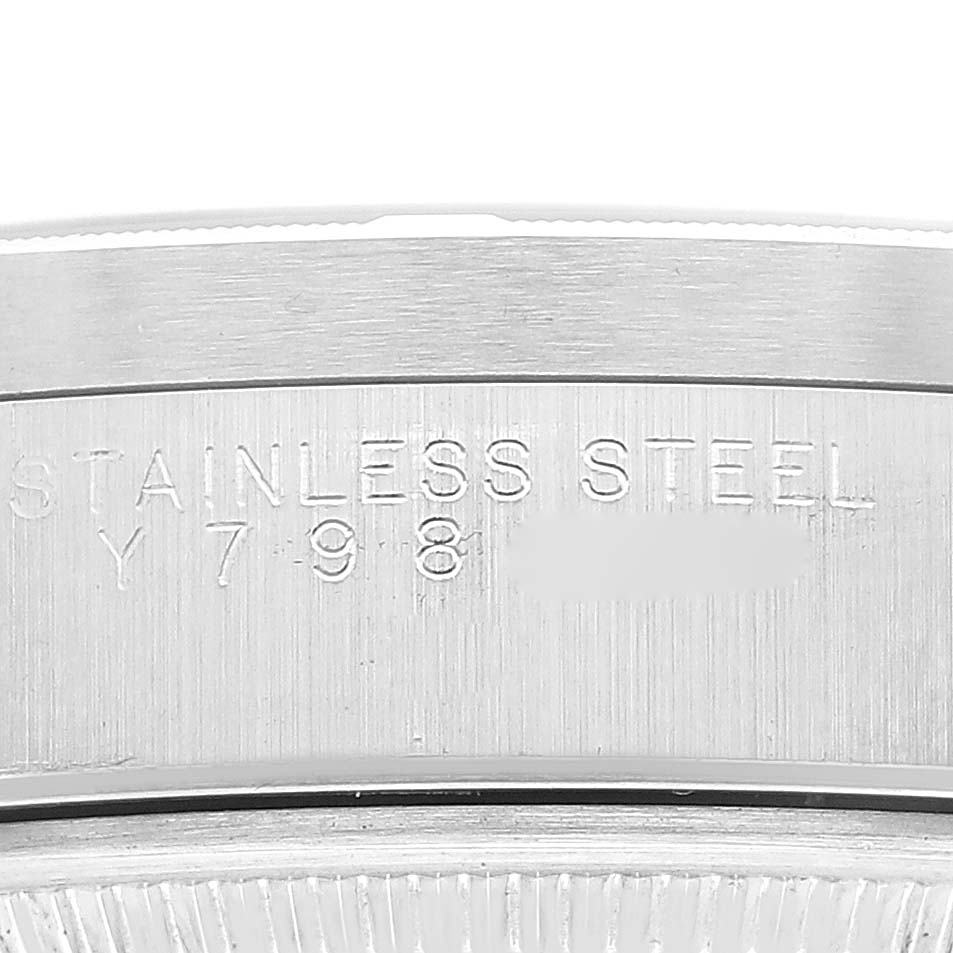 This image shows a close-up of the stainless steel caseback engraving on a Rolex Air-King 14010M Men's Stainless Steel Black Dial 14010M Men's Stainless Steel Black Dial watch.