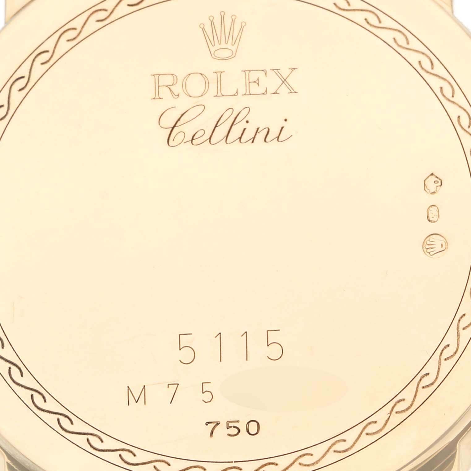 The image shows the back of a Rolex Cellini 5115 Men's Yellow Gold Champagne Dial 5115 Men's Yellow Gold Champagne Dial watch, highlighting its engravings and hallmarks.