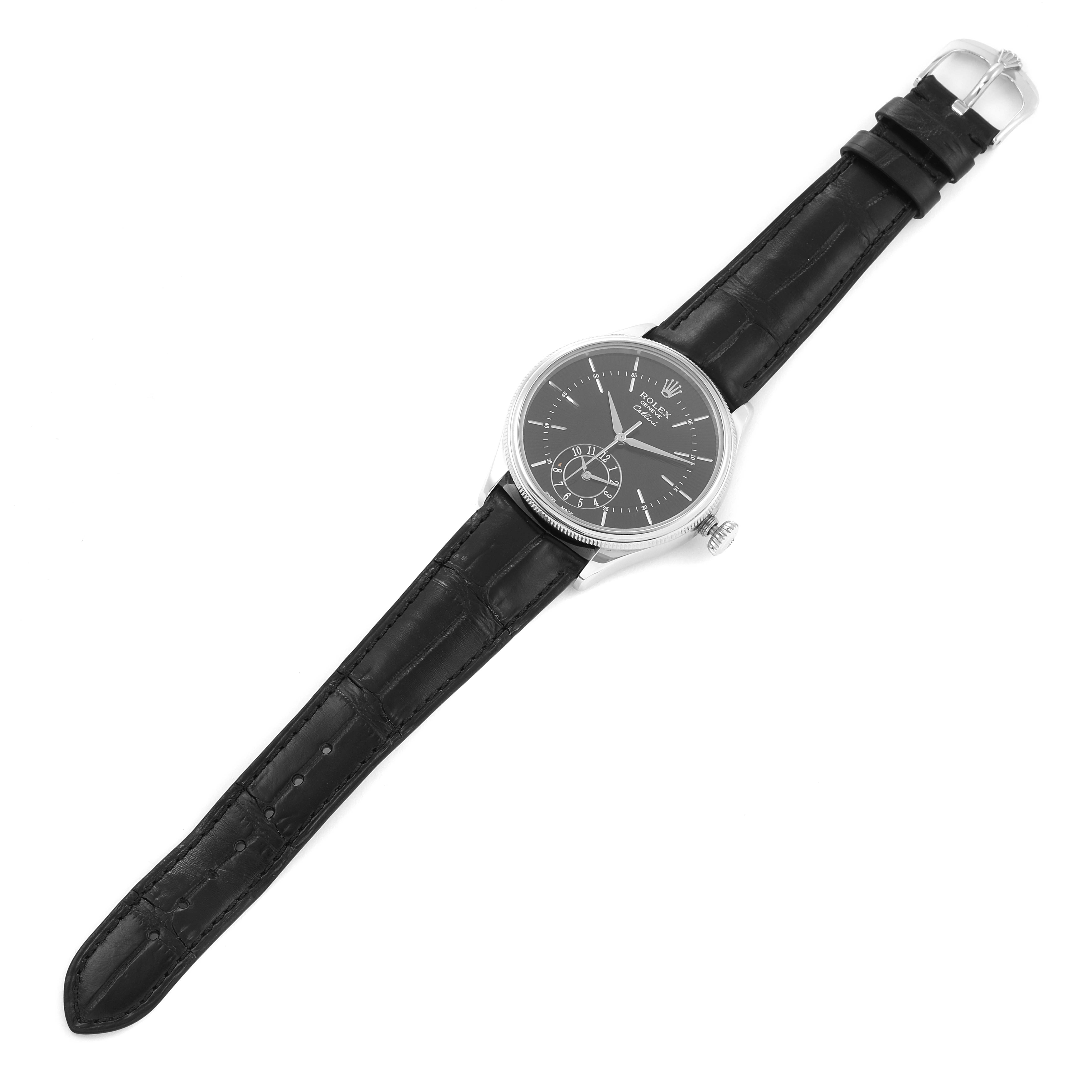 The image shows an overhead view of a Rolex Cellini 50529 Men
s White Gold Black Dial 50529 Men
s White Gold Black Dial watch, highlighting its black dial and leather strap.