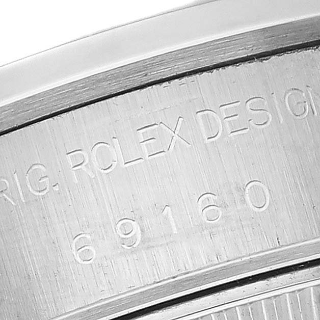 This image shows a close-up of the inner bezel of a Rolex Date 69160 Women
s Stainless Steel White Dial 69160 Women
s Stainless Steel White Dial model, highlighting the engravings.