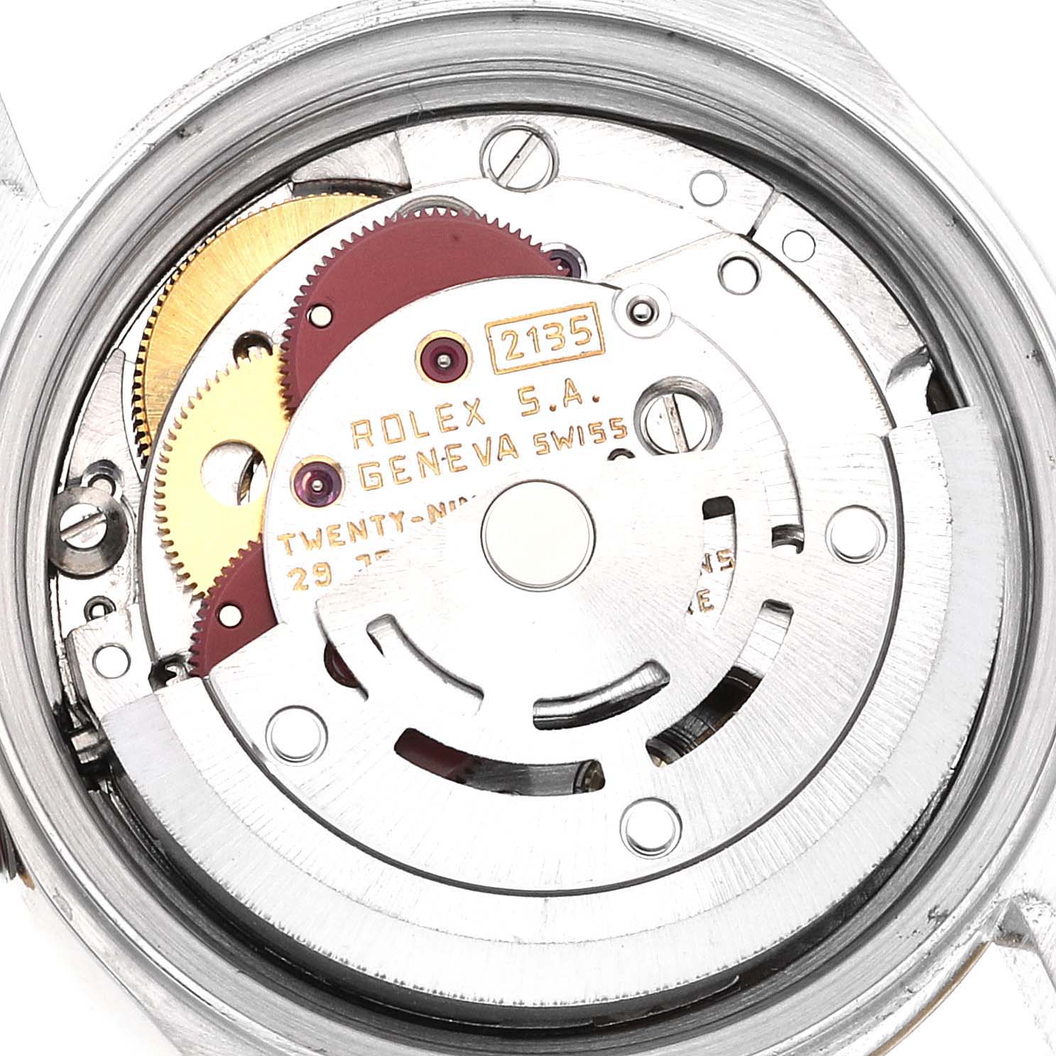 The image shows the movement of a Rolex Datejust 69173 Women's Steel and Gold (two tone) White Dial 69173 Women's Steel and Gold (two tone) White Dial watch from a rear angle, highlighting its gears and mechanisms.