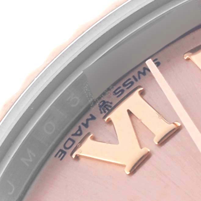 The image shows a close-up of the dial edge and numeral of a Rolex Datejust, highlighting the "Swiss Made" text.