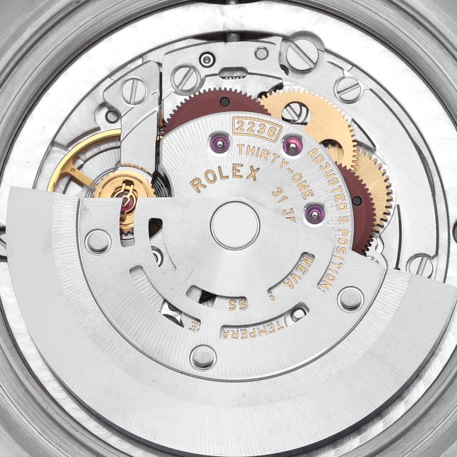 The image shows the movement mechanism of a Rolex Datejust watch from a top-down angle.