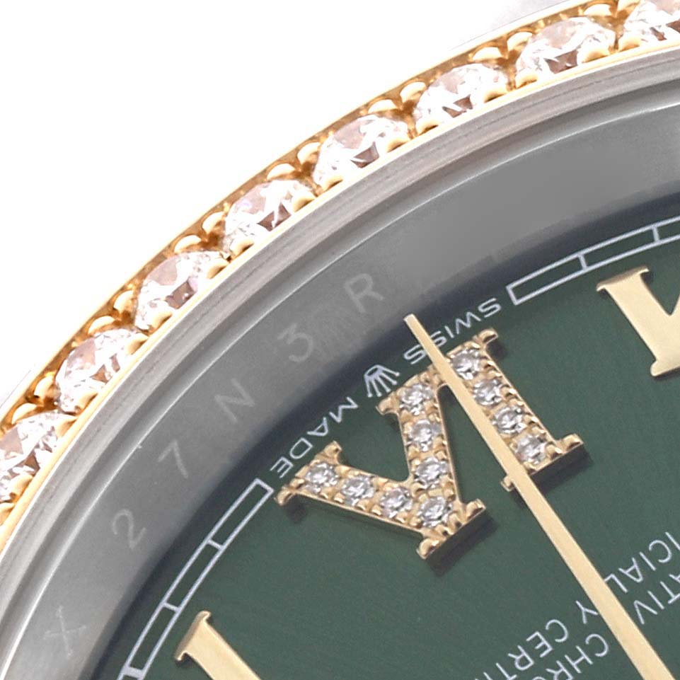 The image shows a close-up of the green dial and diamond-studded bezel of a Rolex Datejust 126283RBR Men's Steel and Gold (two tone) Green Dial 126283RBR Men's Steel and Gold (two tone) Green Dial watch.