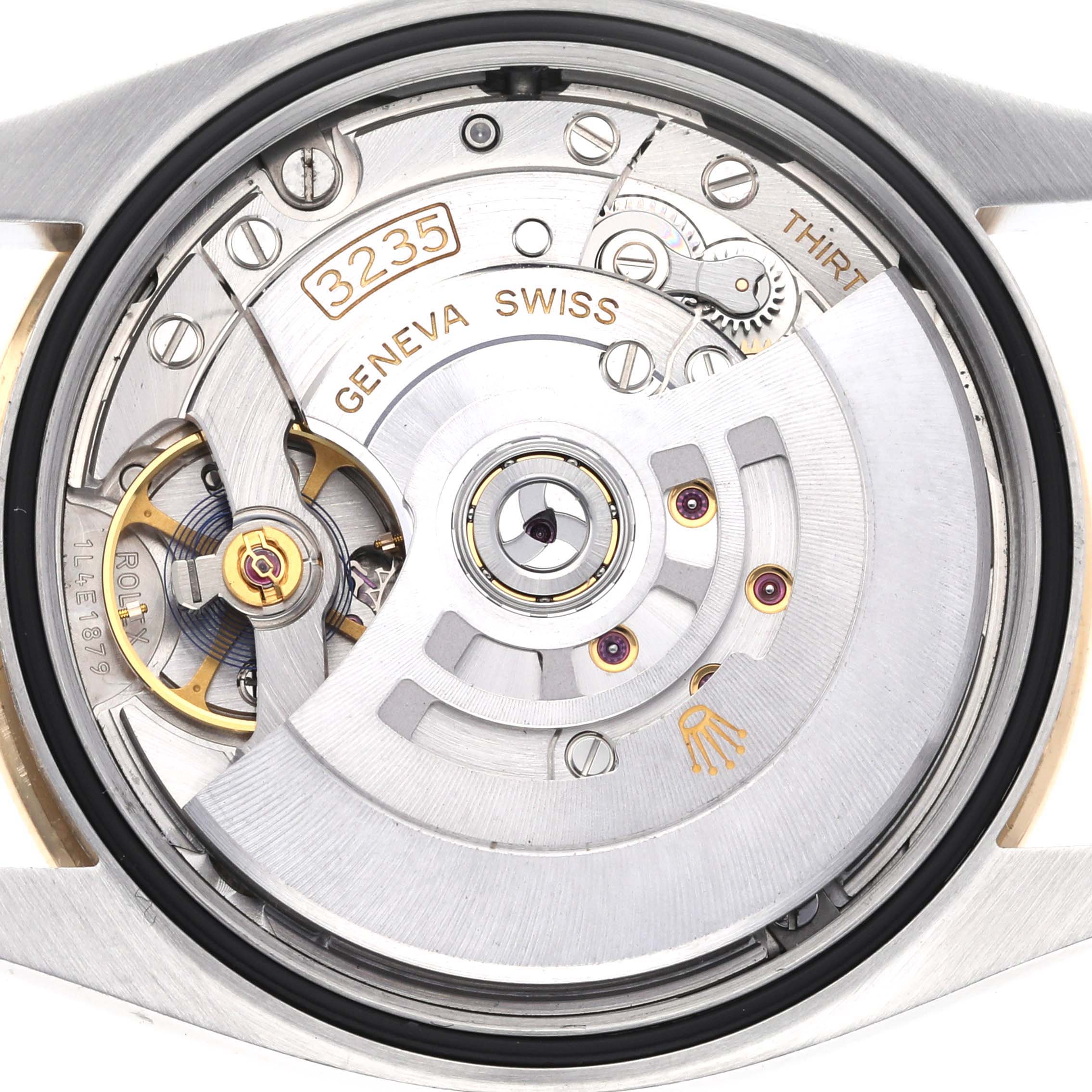 The image shows a close-up view of the Rolex Datejust 126283RBR Men's Steel and Gold (two tone) Green Dial 126283RBR Men's Steel and Gold (two tone) Green Dial's movement from the back.