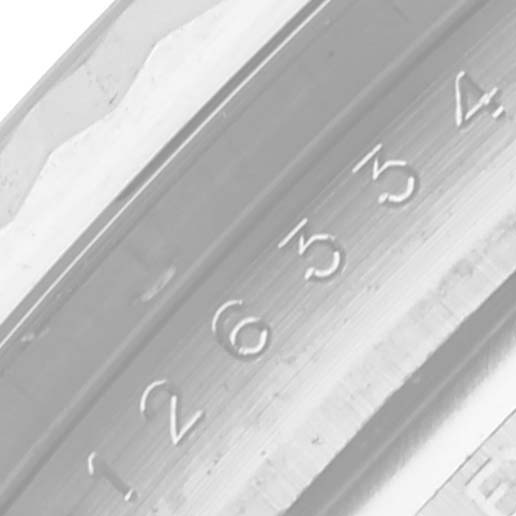 The image shows a close-up view of the serial number engraving on the inner bezel of the Rolex Datejust 41 126334 Men
s Stainless Steel White Dial 126334 Men
s Stainless Steel White Dial watch.