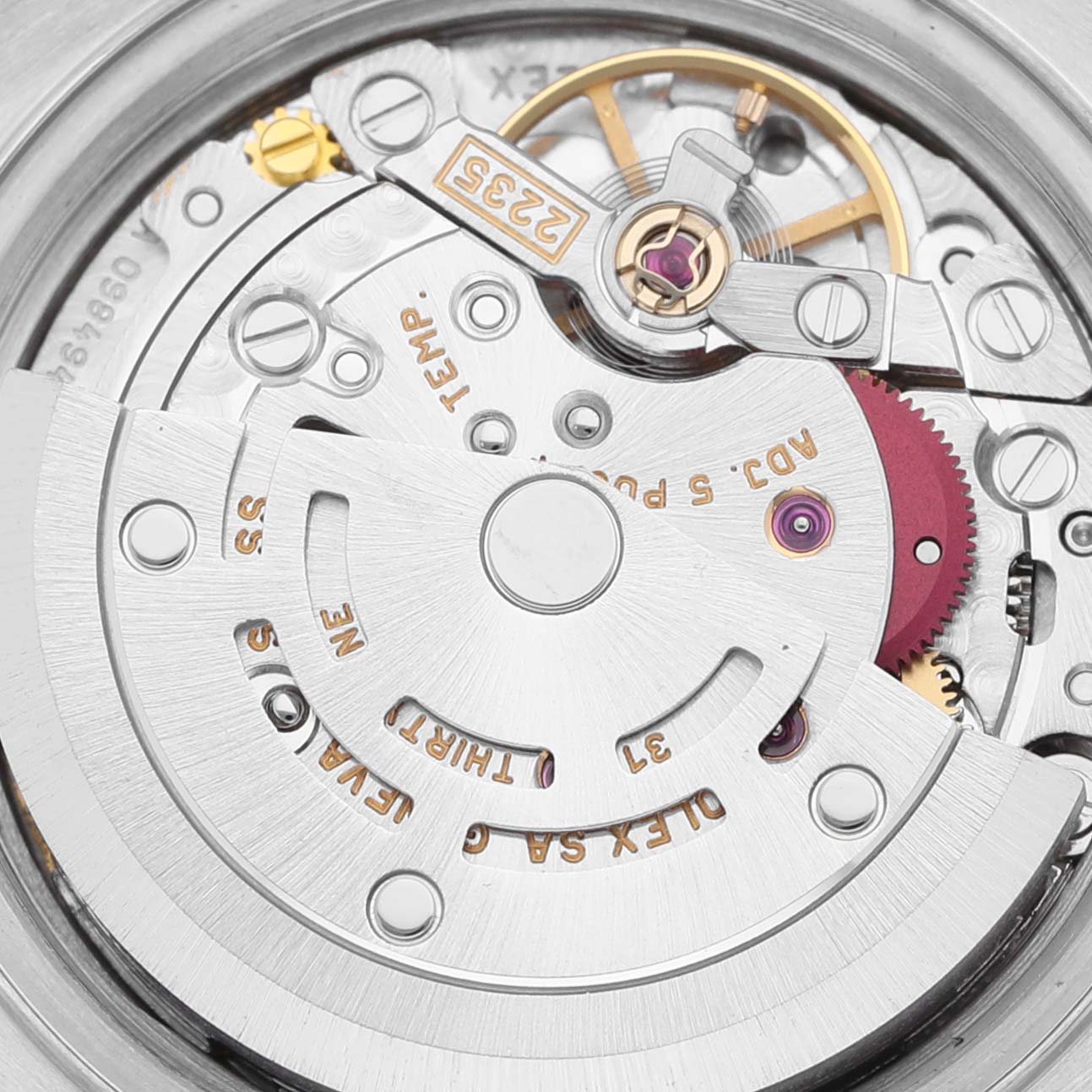 This image shows a close-up view of the Rolex Datejust 79174 Women's Stainless Steel White Dial 79174 Women's Stainless Steel White Dial's movement, including gears and the rotor.