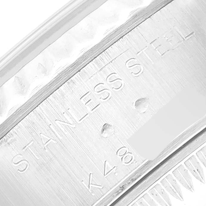 This close-up image shows the engraving on the stainless steel part of the Rolex Datejust 79174 Women's Stainless Steel White Dial 79174 Women's Stainless Steel White Dial watch.