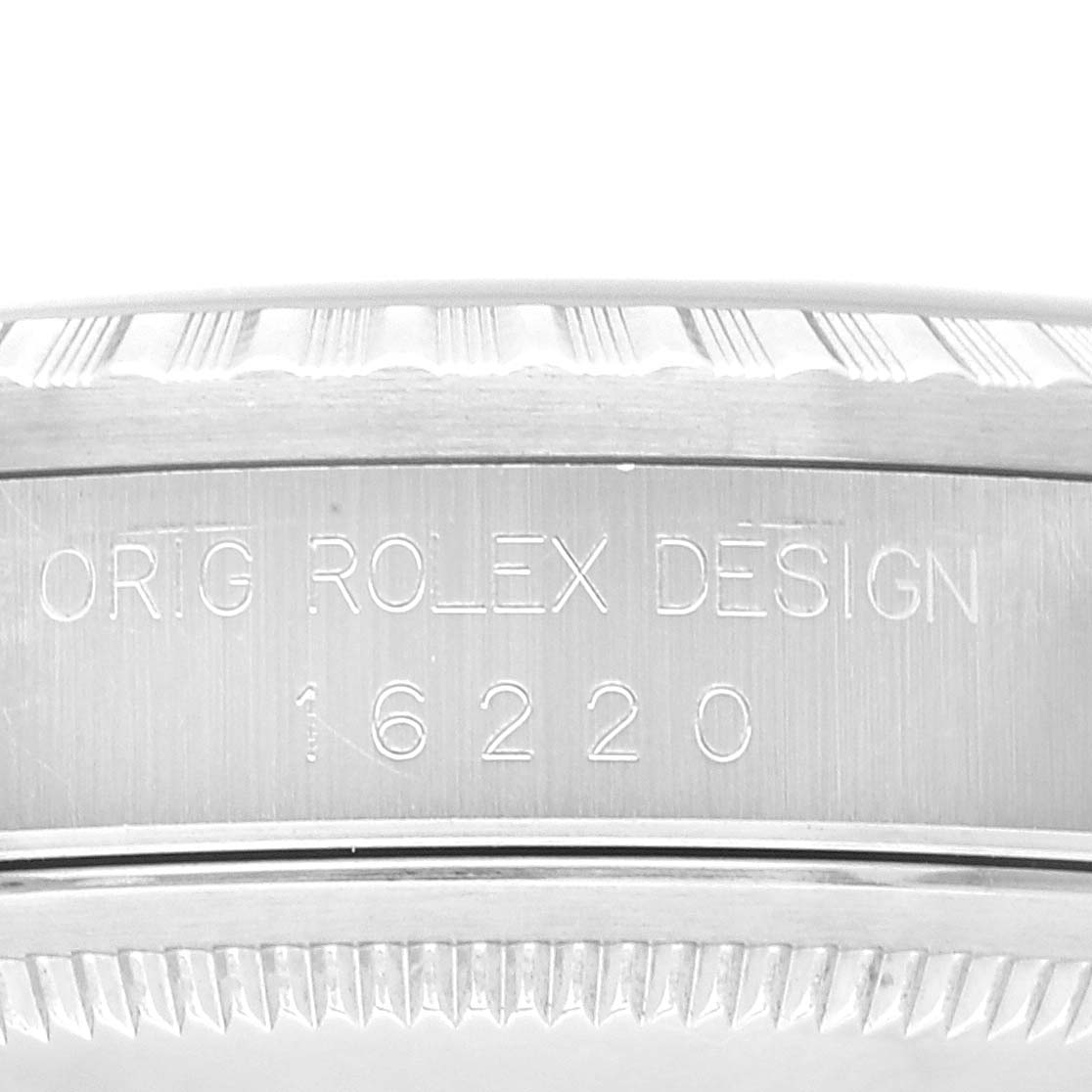 The image shows a close-up of the side of the Rolex Datejust 16220 Men's Stainless Steel Blue Dial 16220 Men's Stainless Steel Blue Dial case, featuring the model number 16220 engraving.