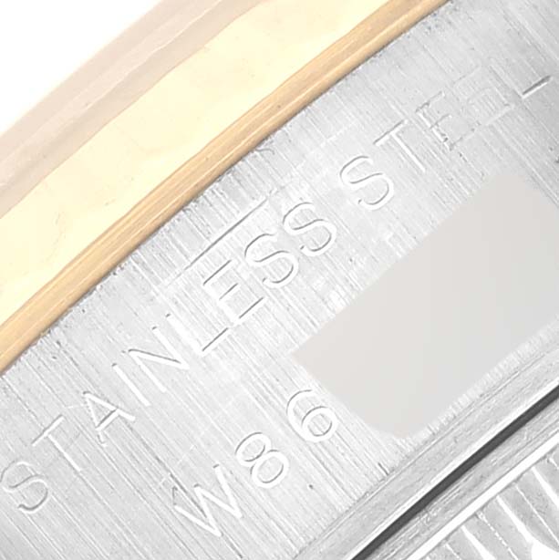 This close-up image of a Rolex Datejust 69173 Women's Steel and Gold (two tone) Blue Dial 69173 Women's Steel and Gold (two tone) Blue Dial watch shows part of the case back with "STAINLESS STEEL" engraved.