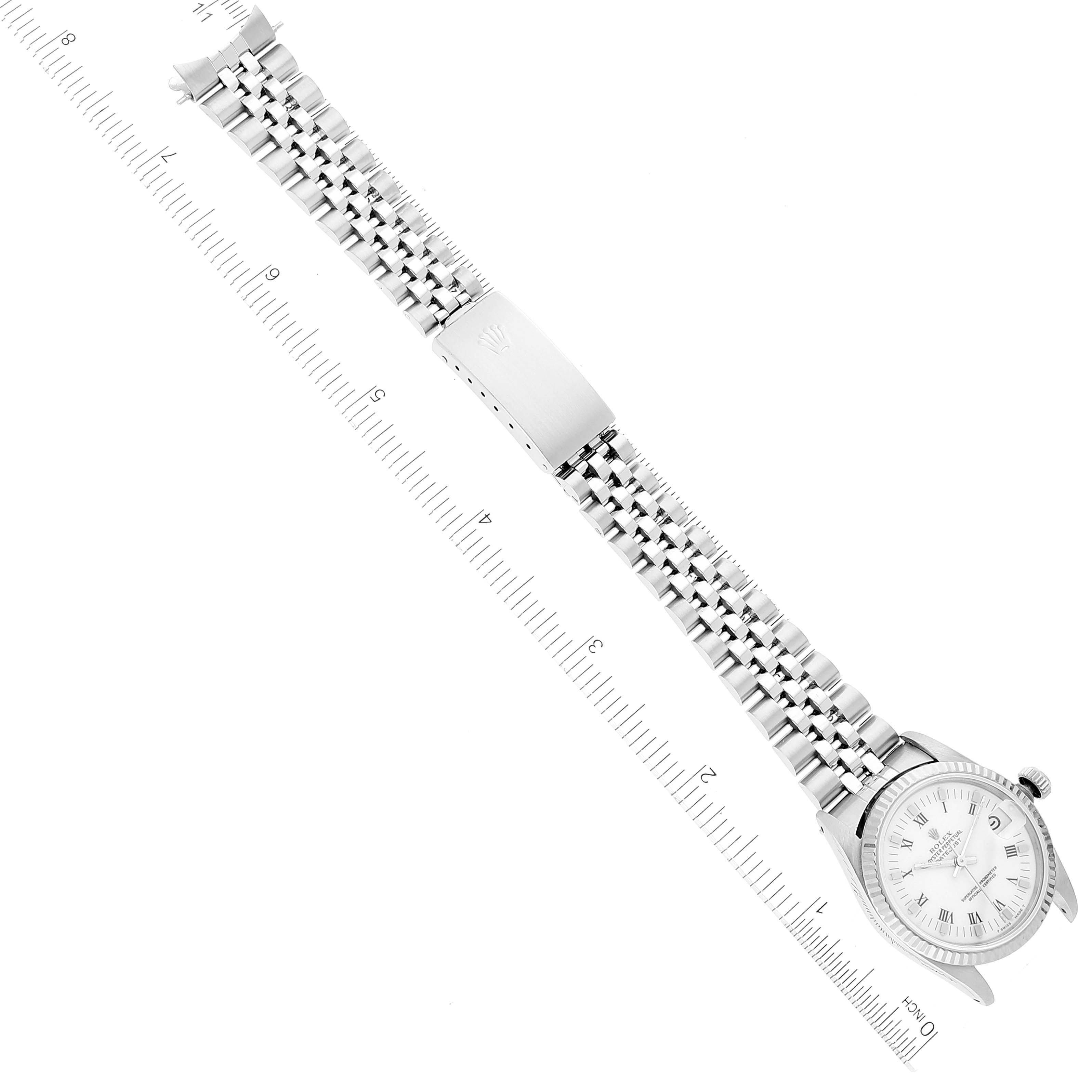 The image shows a top-down view of a Mid-Size Rolex watch, displaying the watch face, bracelet, and clasp against a ruler.