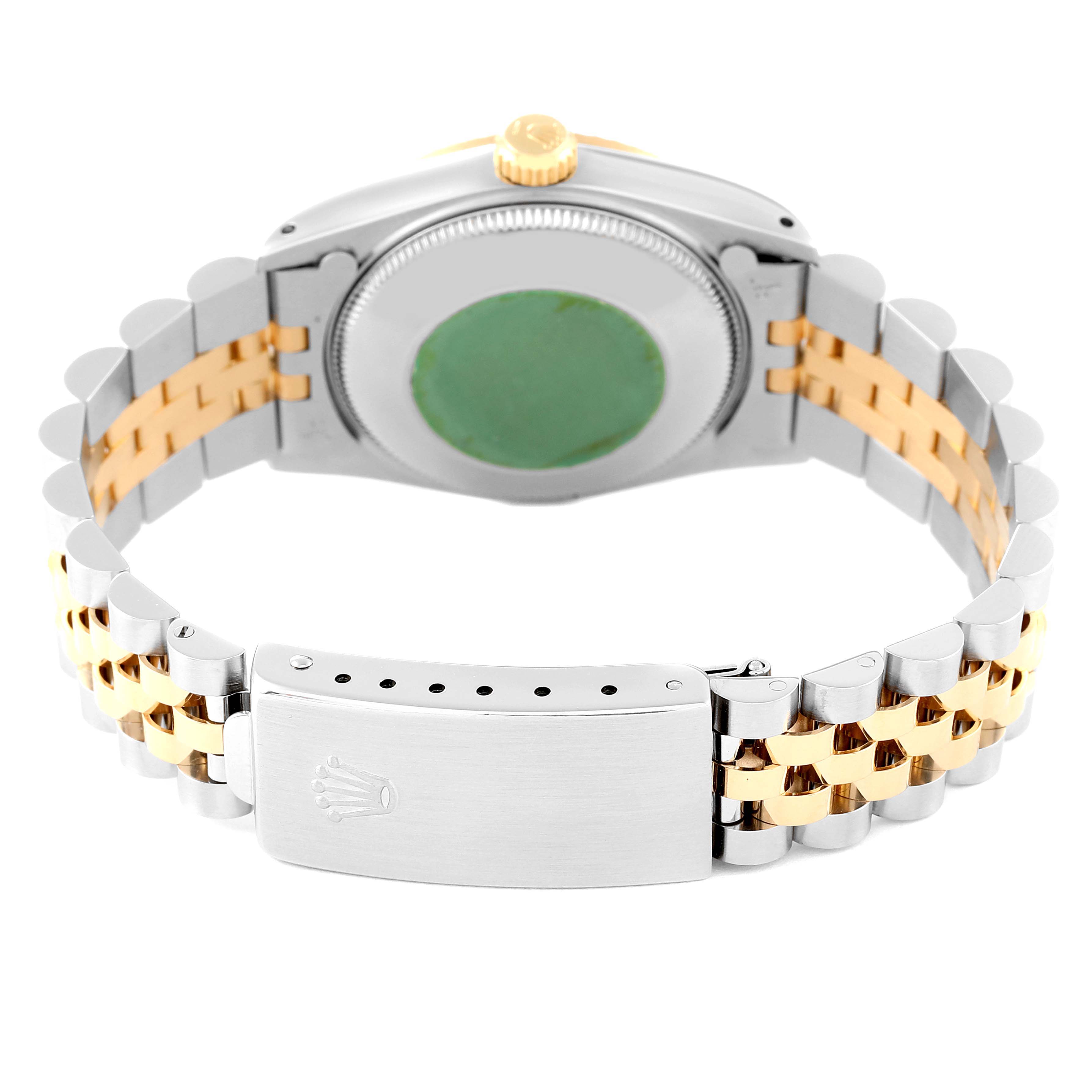 The image shows the back and clasp of a Rolex Mid-Size 68273 Women
s Steel and Gold (two tone) White Dial 68273 Women
s Steel and Gold (two tone) White Dial watch, highlighting the two-tone bracelet and sealed caseback.