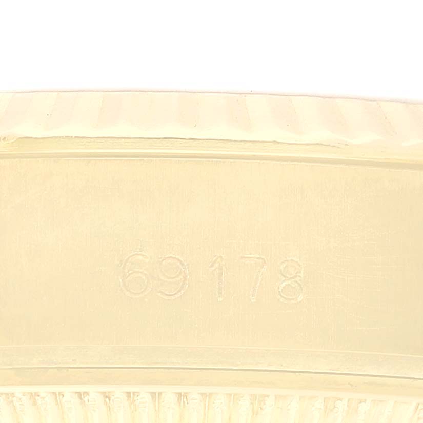 This image shows a close-up of the serial number "69178" on the case of a Rolex President 69178 Women's Yellow Gold Champagne Dial 69178 Women's Yellow Gold Champagne Dial model watch.