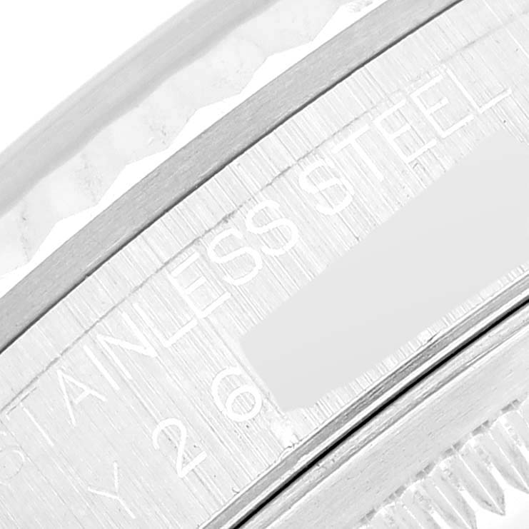 This close-up image shows the stainless steel bezel engraving of a Rolex Datejust 16234 Men's Stainless Steel White Dial 16234 Men's Stainless Steel White Dial watch.
