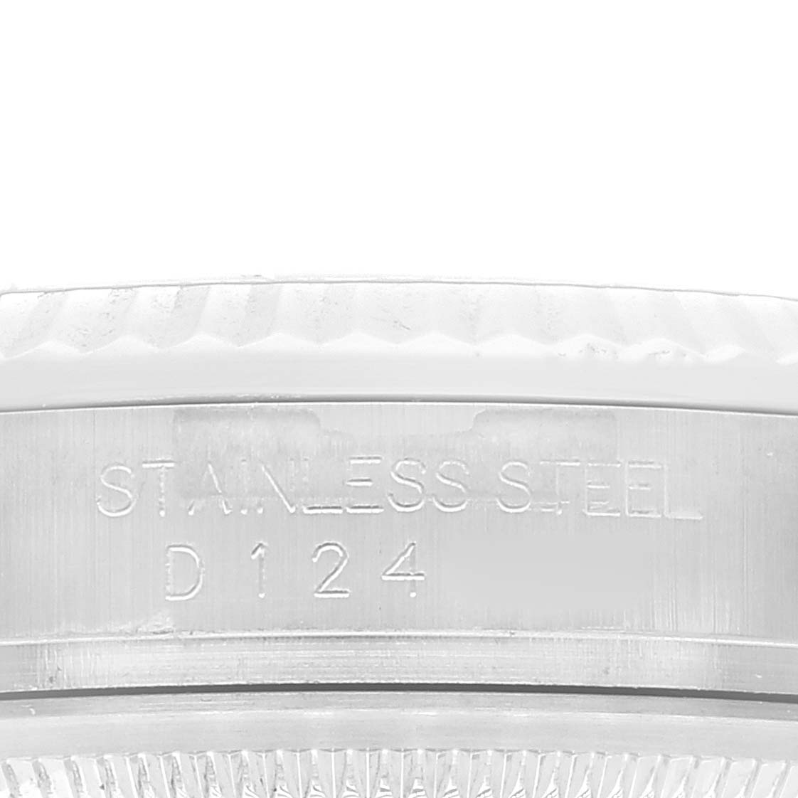 This close-up image of a Rolex Datejust 116234 Men's Stainless Steel Pink Dial 116234 Men's Stainless Steel Pink Dial shows the engraved "STAINLESS STEEL" and serial number on the case back.