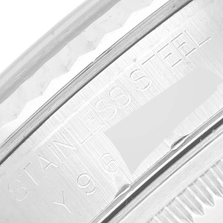 This image shows a close-up of the stainless steel engraving on the case back of a Rolex Datejust 16234 Men's Stainless Steel Black Dial 16234 Men's Stainless Steel Black Dial watch.