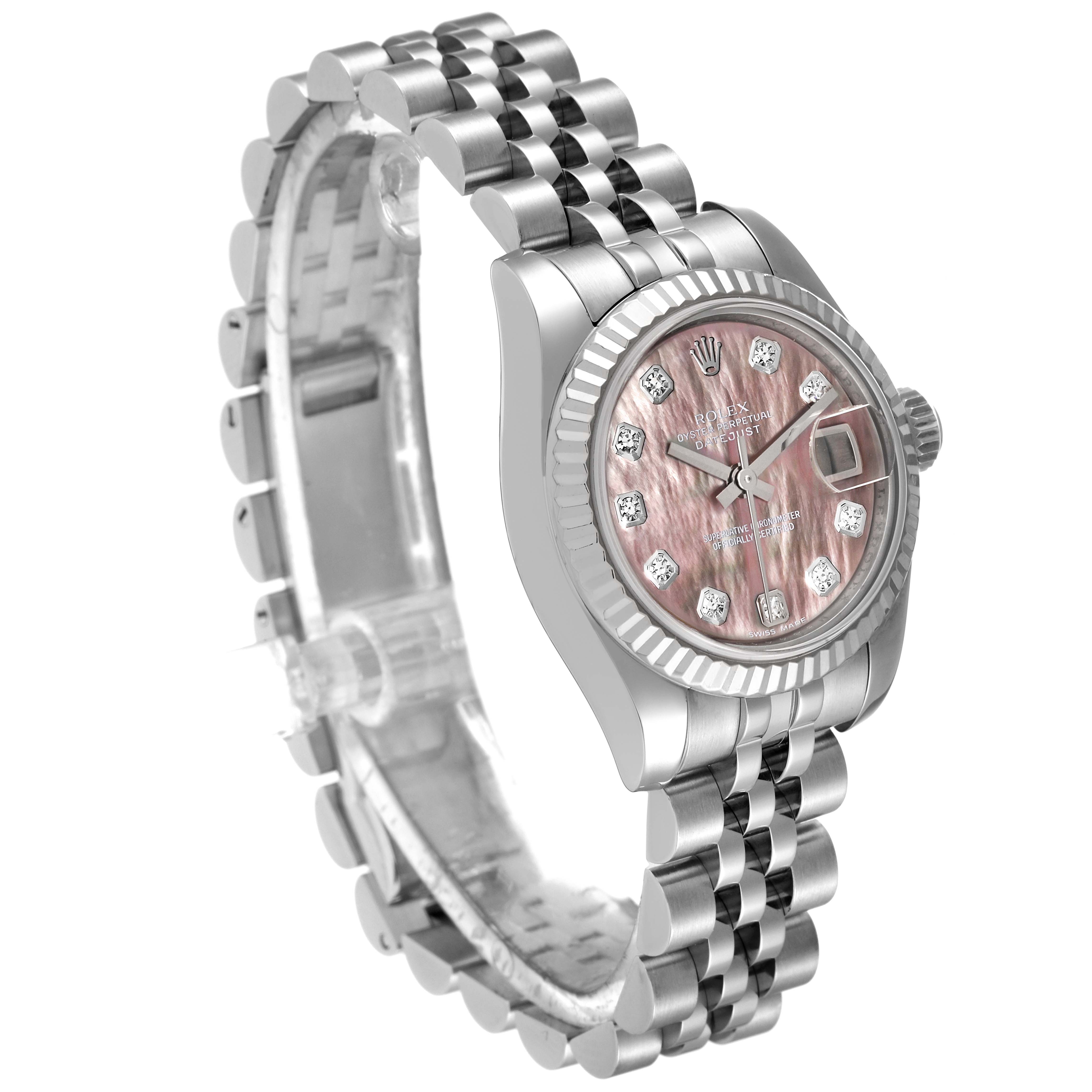 The image displays a Rolex Datejust 179174 Women's Stainless Steel Mother of Pearl Dial 179174 Women's Stainless Steel Mother of Pearl Dial watch at an angled side view, highlighting its pink dial, fluted bezel, and jubilee bracelet.