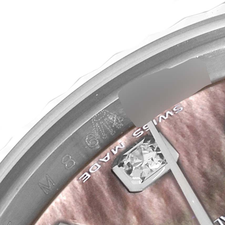 The image shows a close-up of the dial and bezel of a Rolex Datejust 179174 Women's Stainless Steel Mother of Pearl Dial 179174 Women's Stainless Steel Mother of Pearl Dial watch, highlighting the "Swiss Made" marking and a diamond index.