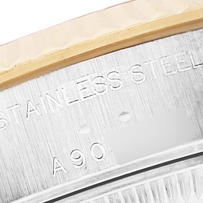 This image shows a close-up of the serial number and "Stainless Steel" engraving on the Rolex Datejust 79173 Women's Steel and Gold (two tone) Champagne Dial 79173 Women's Steel and Gold (two tone) Champagne Dial watch case side.