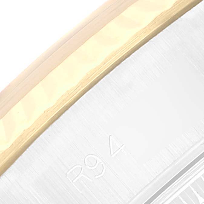 The image shows a close-up of the bezel and part of the case of a Rolex Datejust 69173 Women's Steel and Gold (two tone) Champagne Dial 69173 Women's Steel and Gold (two tone) Champagne Dial watch.