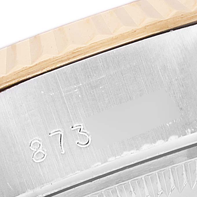 This image shows a close-up of the engraving on the side of the case of a Rolex Datejust 69173 Women's Steel and Gold (two tone) Champagne Dial 69173 Women's Steel and Gold (two tone) Champagne Dial watch.