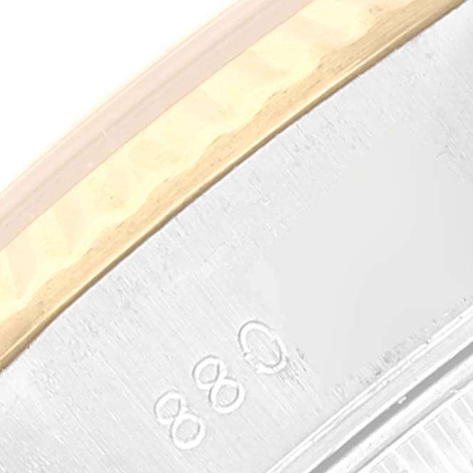 This close-up image shows the edge and partial markings on the bezel of a Rolex Datejust 69173 Women's Steel and Gold (two tone) Champagne Dial 69173 Women's Steel and Gold (two tone) Champagne Dial watch.