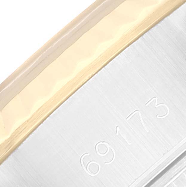 The image shows the case and model number engraving of a Rolex Datejust 69173 Women's Steel and Gold (two tone) Champagne Dial 69173 Women's Steel and Gold (two tone) Champagne Dial watch from a close-up angle.
