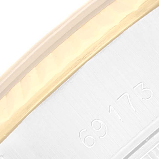 This close-up image shows part of the bezel and the side of a Rolex Datejust 69173 Women's Steel and Gold (two tone) Champagne Dial 69173 Women's Steel and Gold (two tone) Champagne Dial model watch.