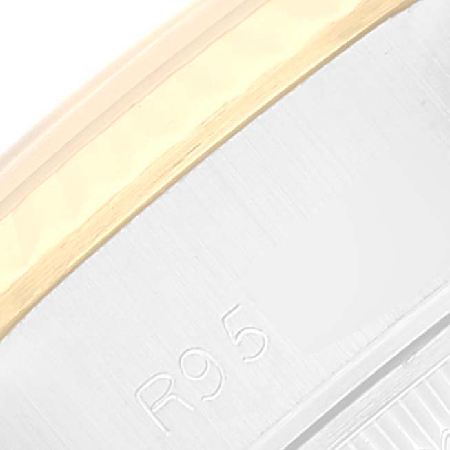The image shows a close-up of the bezel and part of the caseback, with the engraving "R95" on a Rolex Datejust 69173 Women's Steel and Gold (two tone) Champagne Dial 69173 Women's Steel and Gold (two tone) Champagne Dial watch.