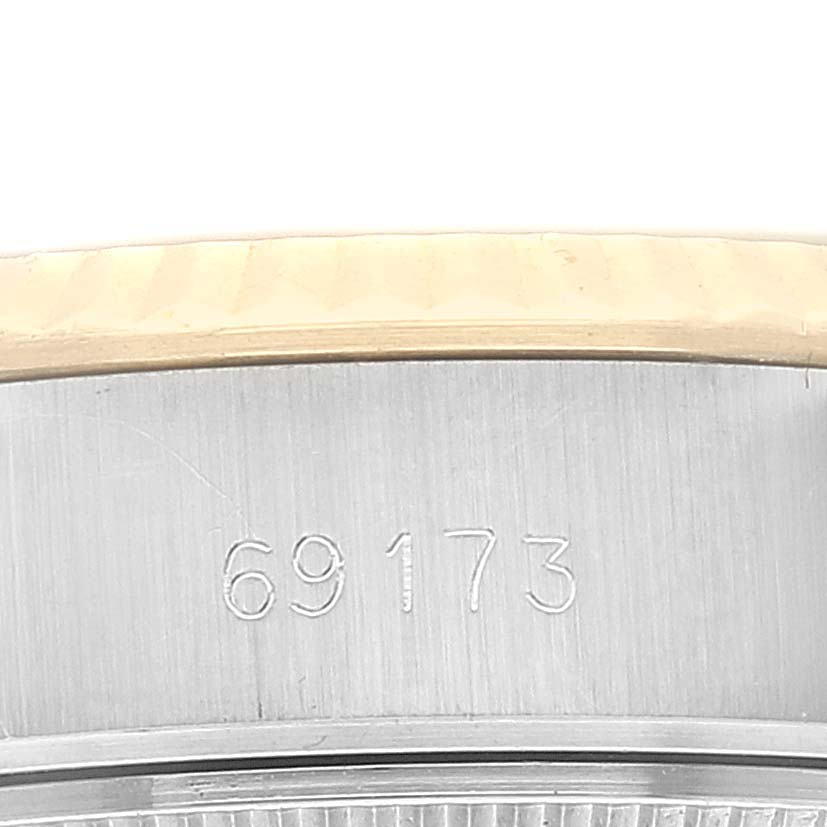 This image shows a close-up of the case side, bezel, and engraved model number of the Rolex Datejust 69173 Women's Steel and Gold (two tone) Champagne Dial 69173 Women's Steel and Gold (two tone) Champagne Dial.
