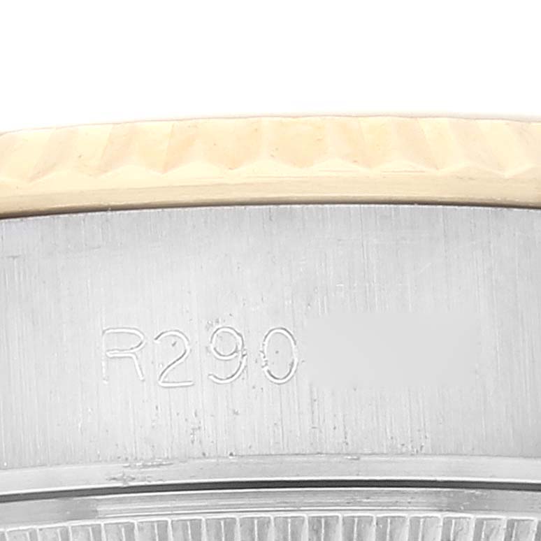 The image shows a close-up of the serial number engraved on the case side of a Rolex Datejust 69173 Women's Steel and Gold (two tone) Champagne Dial 69173 Women's Steel and Gold (two tone) Champagne Dial watch, along with part of the bezel.