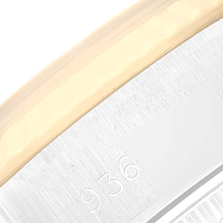 This close-up image shows a segment of the bezel and case side of a Rolex Datejust 69173 Women's Steel and Gold (two tone) Champagne Dial 69173 Women's Steel and Gold (two tone) Champagne Dial watch.