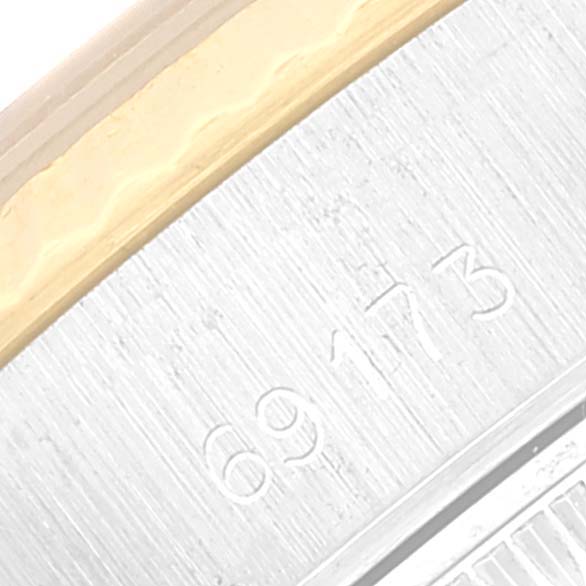 This close-up image of a Rolex Datejust 69173 Women's Steel and Gold (two tone) Champagne Dial 69173 Women's Steel and Gold (two tone) Champagne Dial watch shows part of the caseback and the model number "69173."