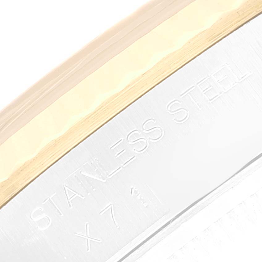 The image shows a close-up of the side of a Rolex Datejust 16233 Men's Steel and Gold (two tone) Beige Dial 16233 Men's Steel and Gold (two tone) Beige Dial watch, highlighting the "STAINLESS STEEL" engraving.