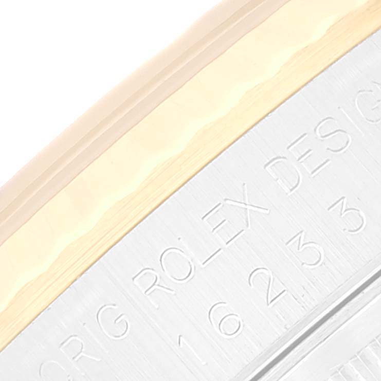 This image shows a close-up of the case and bezel of a Rolex Datejust 16233 Men's Steel and Gold (two tone) Beige Dial 16233 Men's Steel and Gold (two tone) Beige Dial watch, highlighting part of the "ORIG ROLEX DESIGN" engraving.