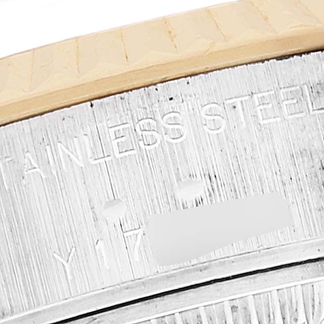 This close-up angle shows the engraved markings and part of the bezel on a Rolex Datejust 79173 Women's Steel and Gold (two tone) Mother of Pearl Dial 79173 Women's Steel and Gold (two tone) Mother of Pearl Dial watch.