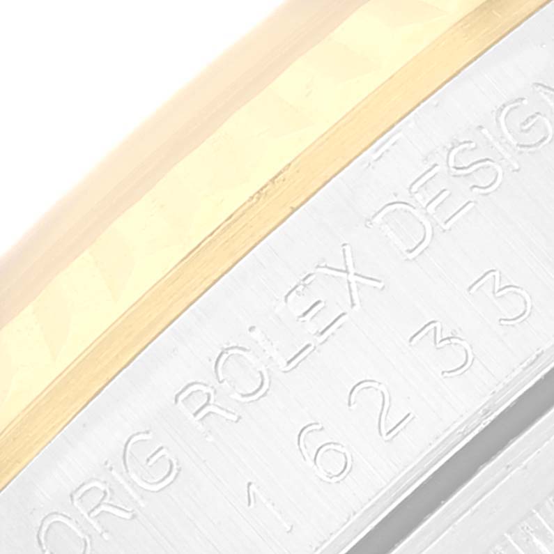 This image shows a close-up of the case side and bezel, highlighting the engraved details of the Rolex Datejust 16233 Men's Steel and Gold (two tone) Silver Dial 16233 Men's Steel and Gold (two tone) Silver Dial model.