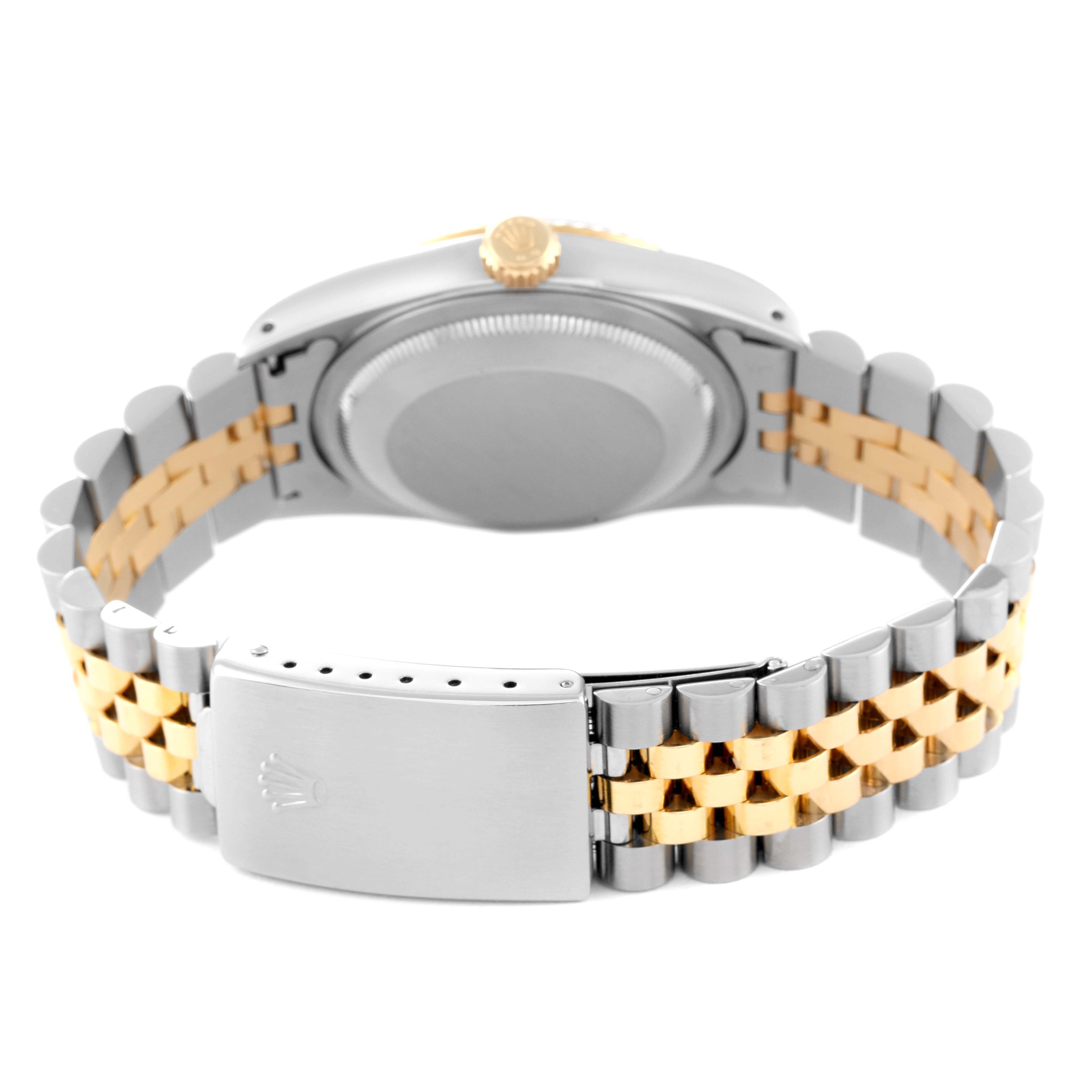 The image shows the back view of a Rolex Datejust 16233 Men's Steel and Gold (two tone) Silver Dial 16233 Men's Steel and Gold (two tone) Silver Dial watch, featuring its clasp, case back, and two-tone bracelet.
