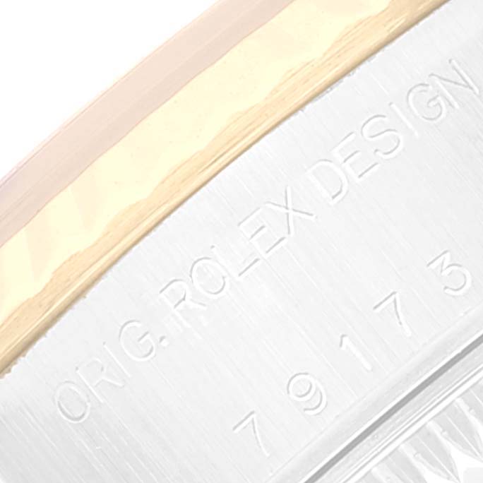 This image shows a close-up of the engraved inner bezel of a Rolex Datejust 79173 Women's Steel and Gold (two tone) Grey Dial 79173 Women's Steel and Gold (two tone) Grey Dial watch.