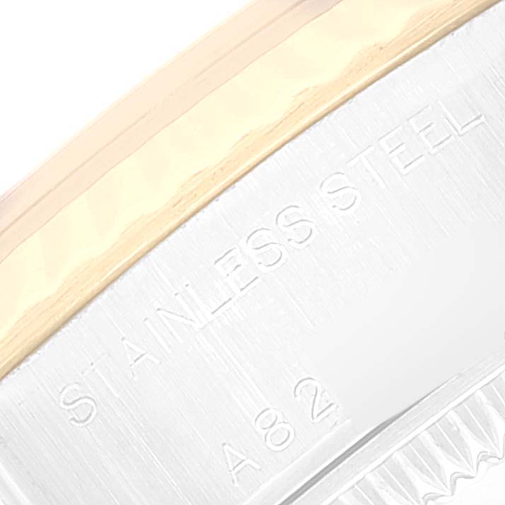 This image shows a close-up of the stainless steel and gold bezel of a Rolex Datejust 79173 Women's Steel and Gold (two tone) Grey Dial 79173 Women's Steel and Gold (two tone) Grey Dial watch.